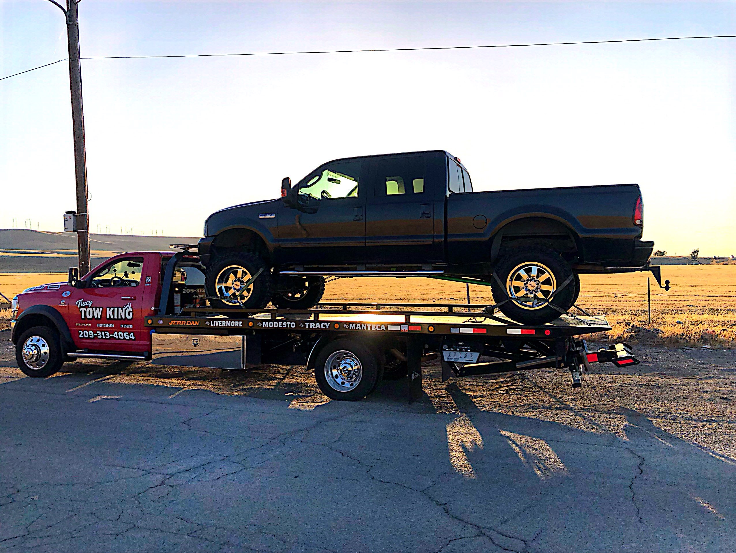 Tracy tow king with a truck on the tow truck